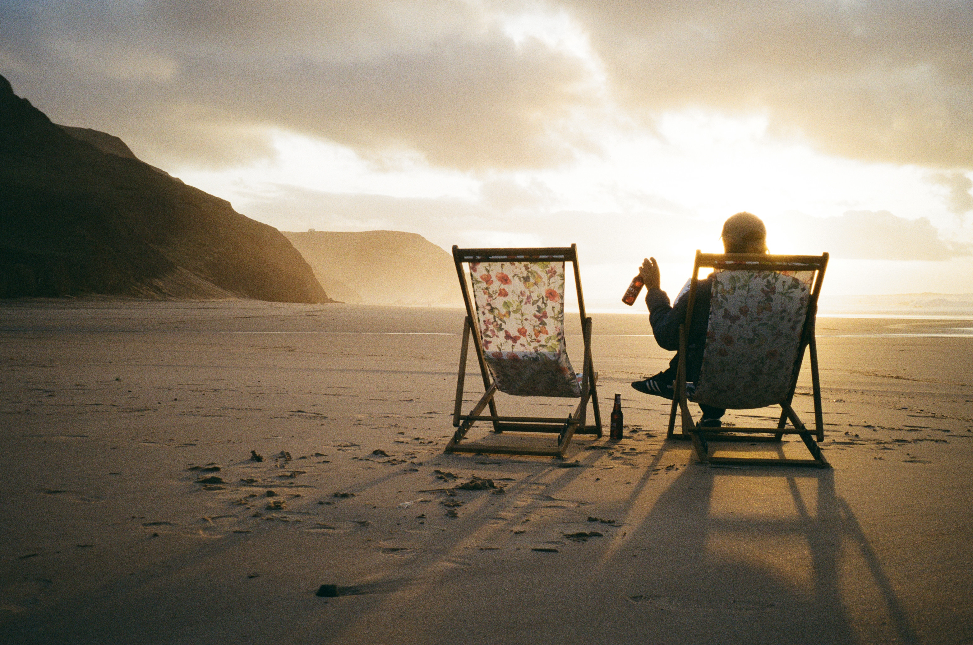 Christof relaxing on a beach at sunset